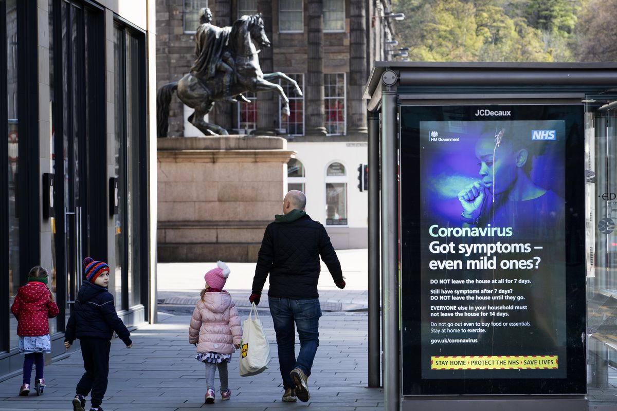 Information posters displayed on the side of a bus stop shelter in Princes Street, Edinburgh