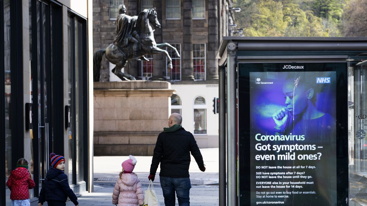 Information posters displayed on the side of a bus stop shelter in Princes Street, Edinburgh