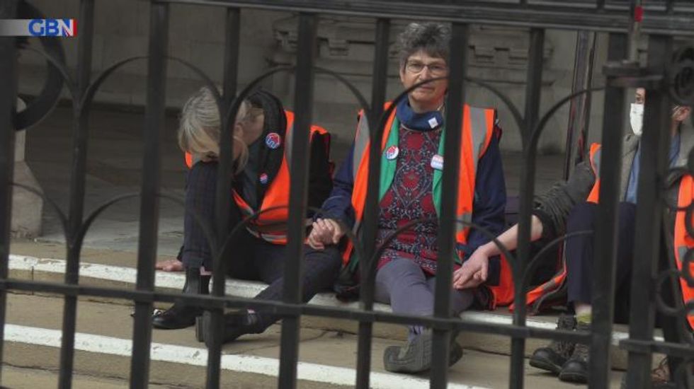 Insulate Britain protesters in custody after gluing themselves to court steps