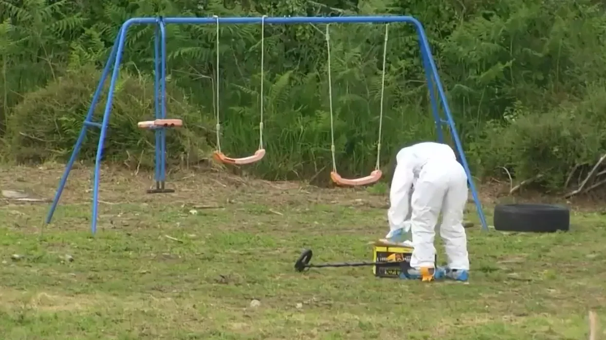 Investigators at the home of a British family following a shooting in north west France