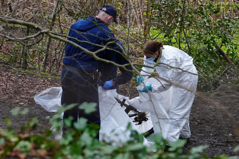 Investigators at the scene in Salford