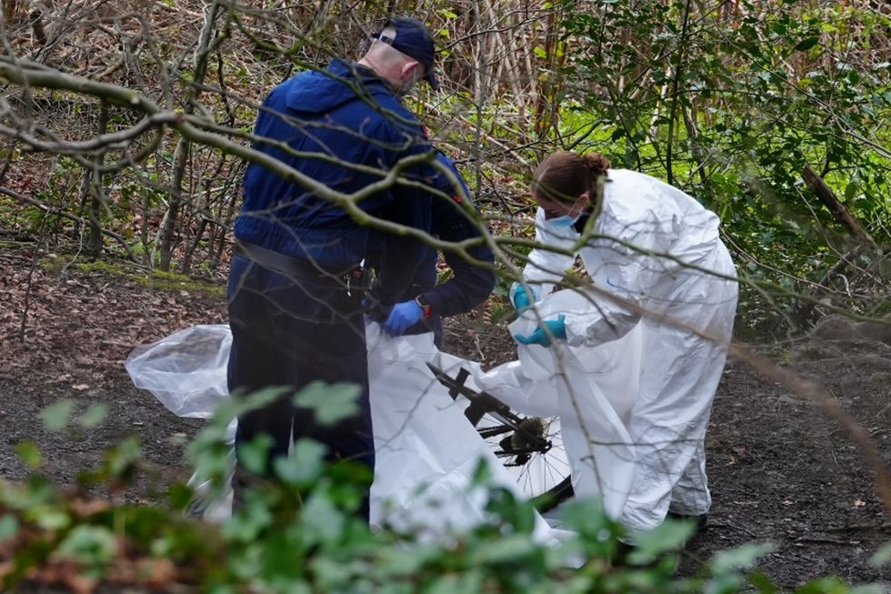 Investigators at the scene in Salford