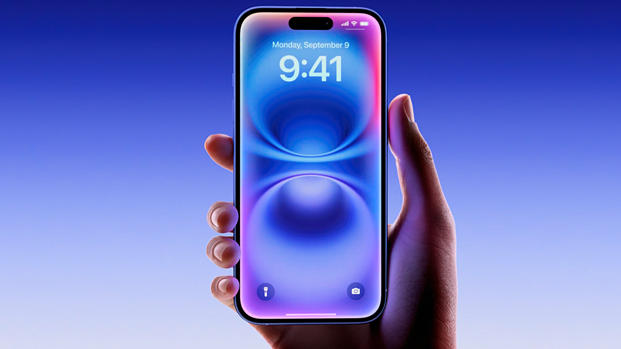 iphone 16 in ultramarine in someones hand with new siri animation