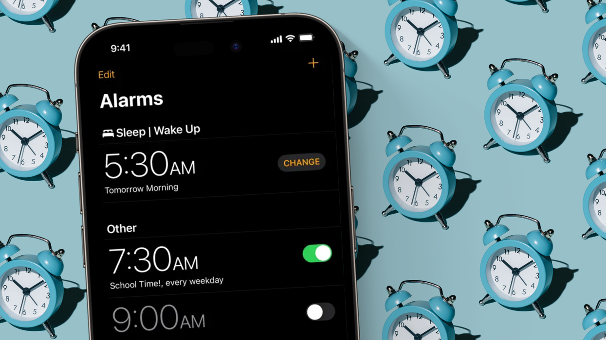 iphone pictured with an alarm set