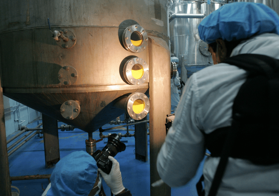 Iranian and foreign photographers take pictures of machines using yellow cakes to produce Uranium hexafluoride (UF6) at the Iranian Isfahan Uranium Conversion Facilities (UCF), 420 kms south of Tehran, 03 February 2007