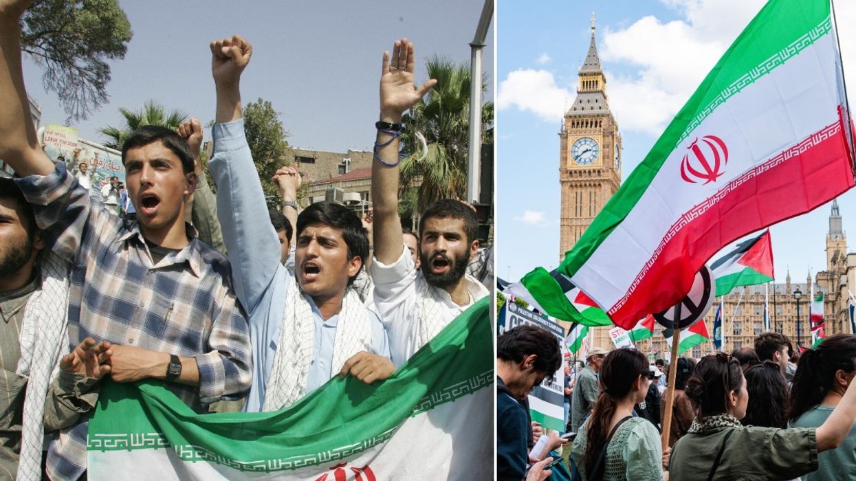 Iranian demonstrators holding their national flag chant slogans against US and Britain during a demonstration in front of the British embassy in Tehran