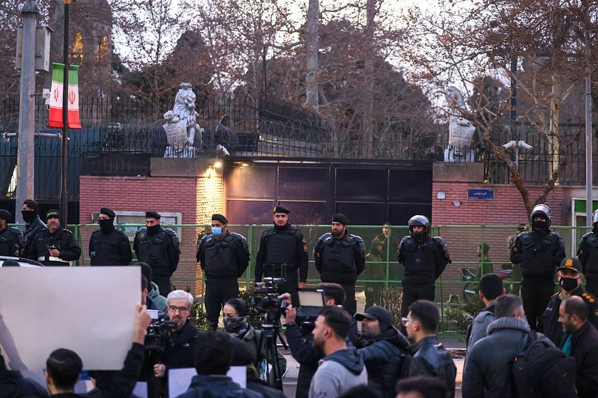 Iranian police stand guard in front of the British Embassy in Tehran