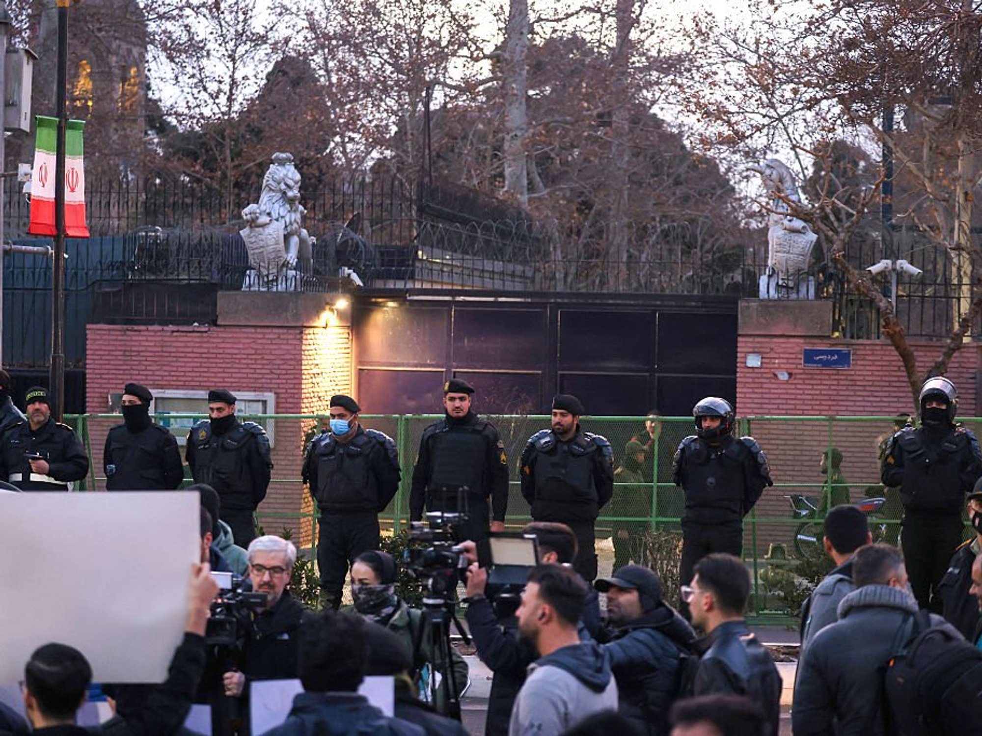 Iranian police stand guard in front of the British Embassy in Tehran