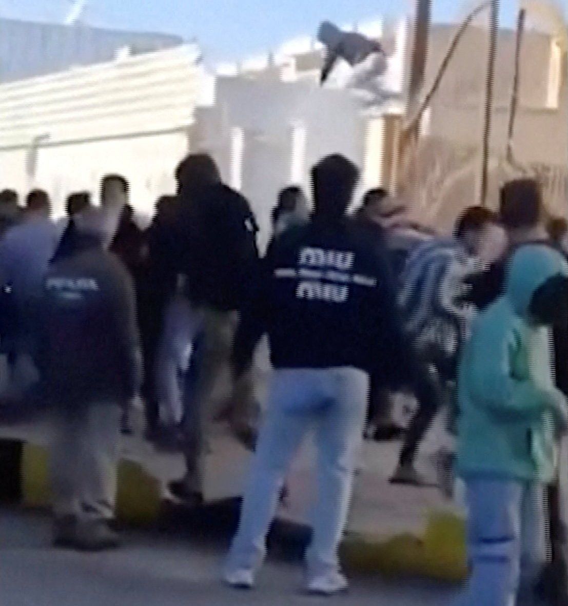 Iranian protestors attempt to storm government building in Tehran