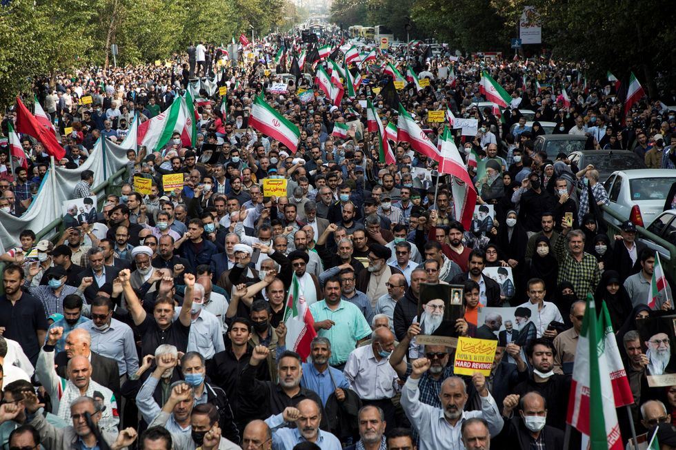 Iranians march during a protest condemning the Shiraz attack and unrest in Tehran, Iran October 28, 2022. WANA (West Asia News Agency) via REUTERS ATTENTION EDITORS - THIS PICTURE WAS PROVIDED BY A THIRD PARTY