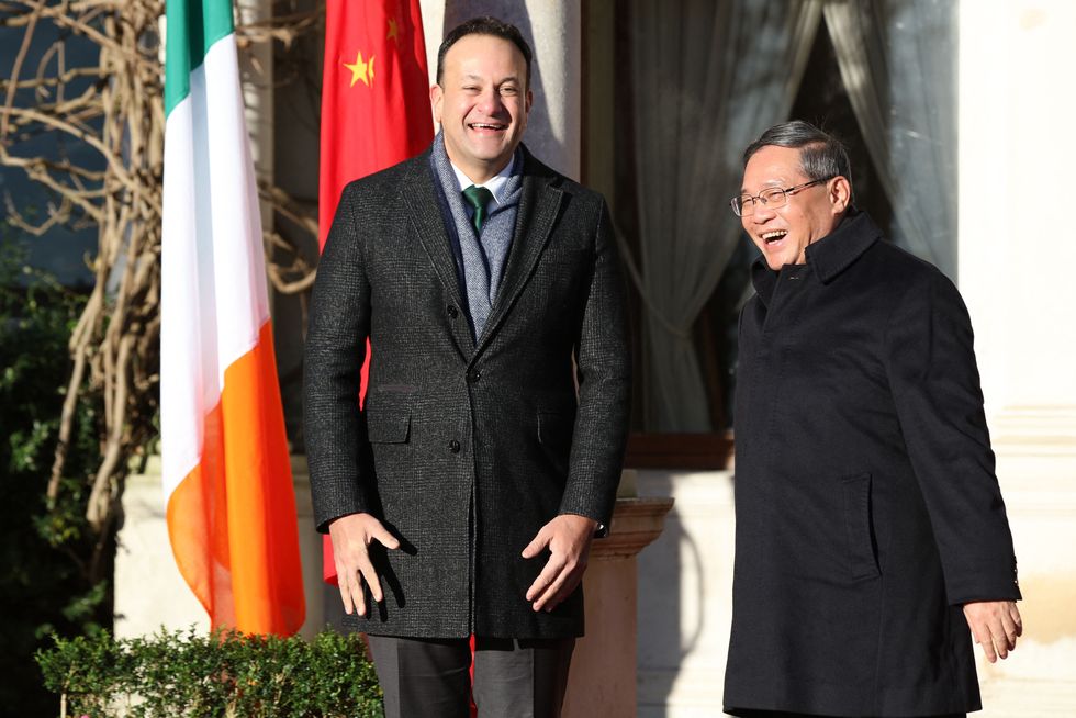 Irish Prime Minister (Taoiseach) Leo Varadkar (L) shares a laugh with Chinese Premier Li Qiang at the start of a meeting at Framleigh House in Phoenix Park in Dublin