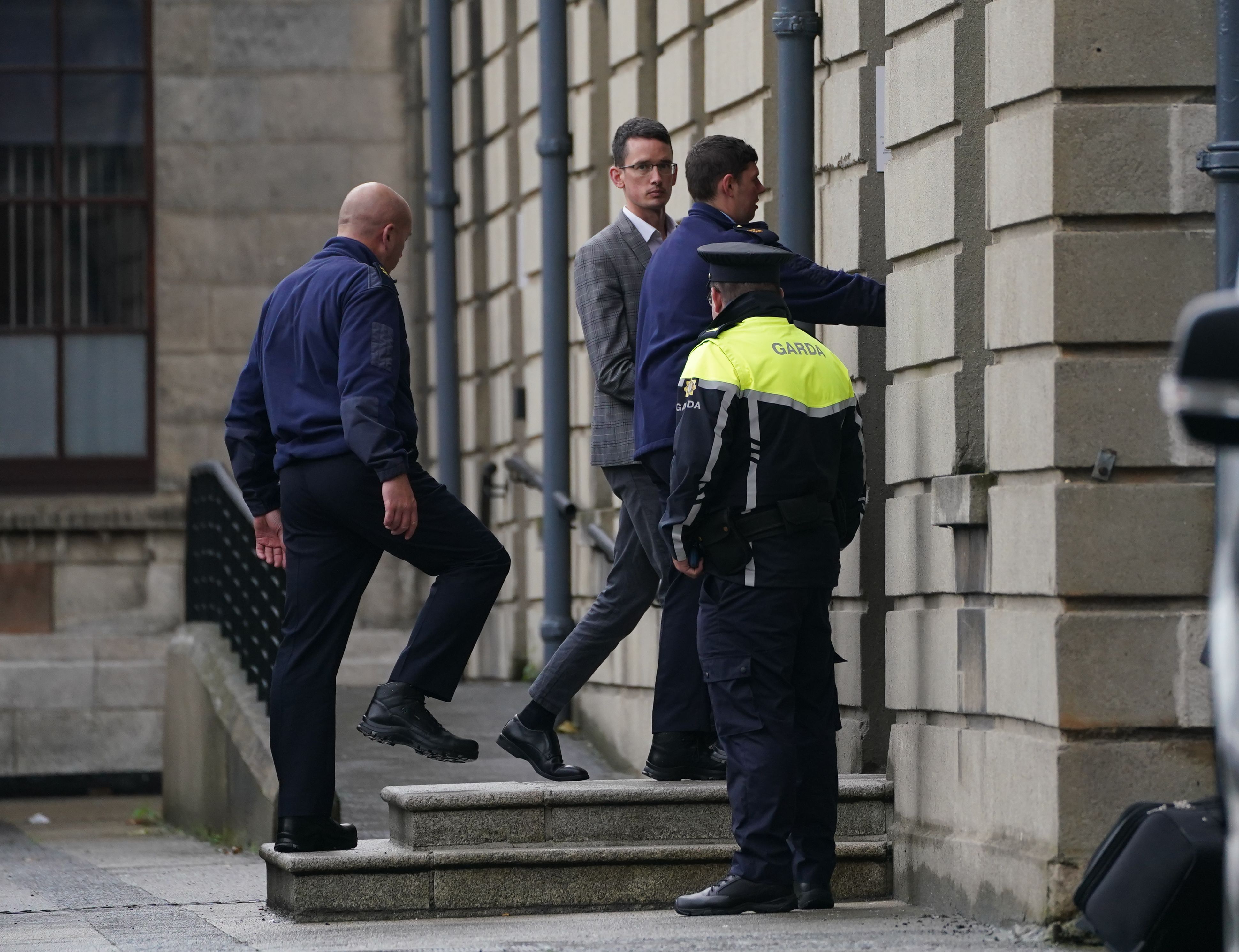 Irish schoolteacher Enoch Burke (centre) arriving at the High Court, Dublin, after he was committed to Mountjoy Prison in Dublin for breaching a temporary court order that he was to stay away from his workplace, Wilson's Hospital School in Co Westmeath, and not to attend the classroom. Mr Burke, who is an evangelical Christian, was suspended from work on full pay last month pending the outcome of a disciplinary process after a number of incidents which stemmed from a transgender row. Picture date: Wednesday September 7, 2022.