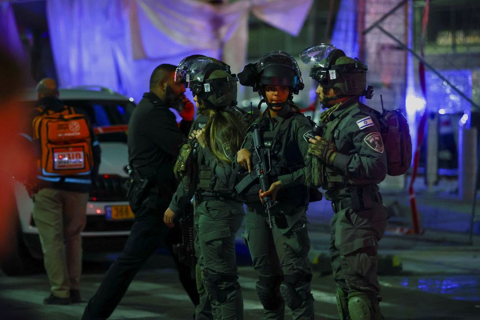 Israeli forces stand guard near the scene of a shooting attack in Neve Yaacov which lies on occupied land that Israel annexed to\u00a0Jerusalem\u00a0after the 1967 Middle East war January 27, 2023. REUTERS/Ronen Zvulun