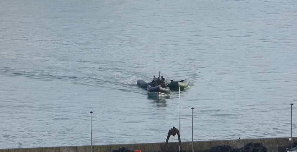 It follows an incident reported to the police on 15 June, after a speedboat was seen dropping a group of suspected migrants on a beach near Dartmouth