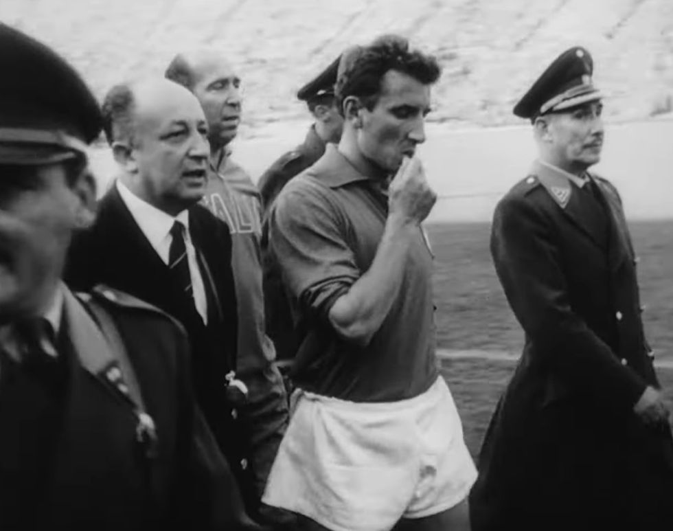 Italy's Giorgio Ferrini was sent off but refused to leave the pitch, as police officers were forced to escort him off the pitch