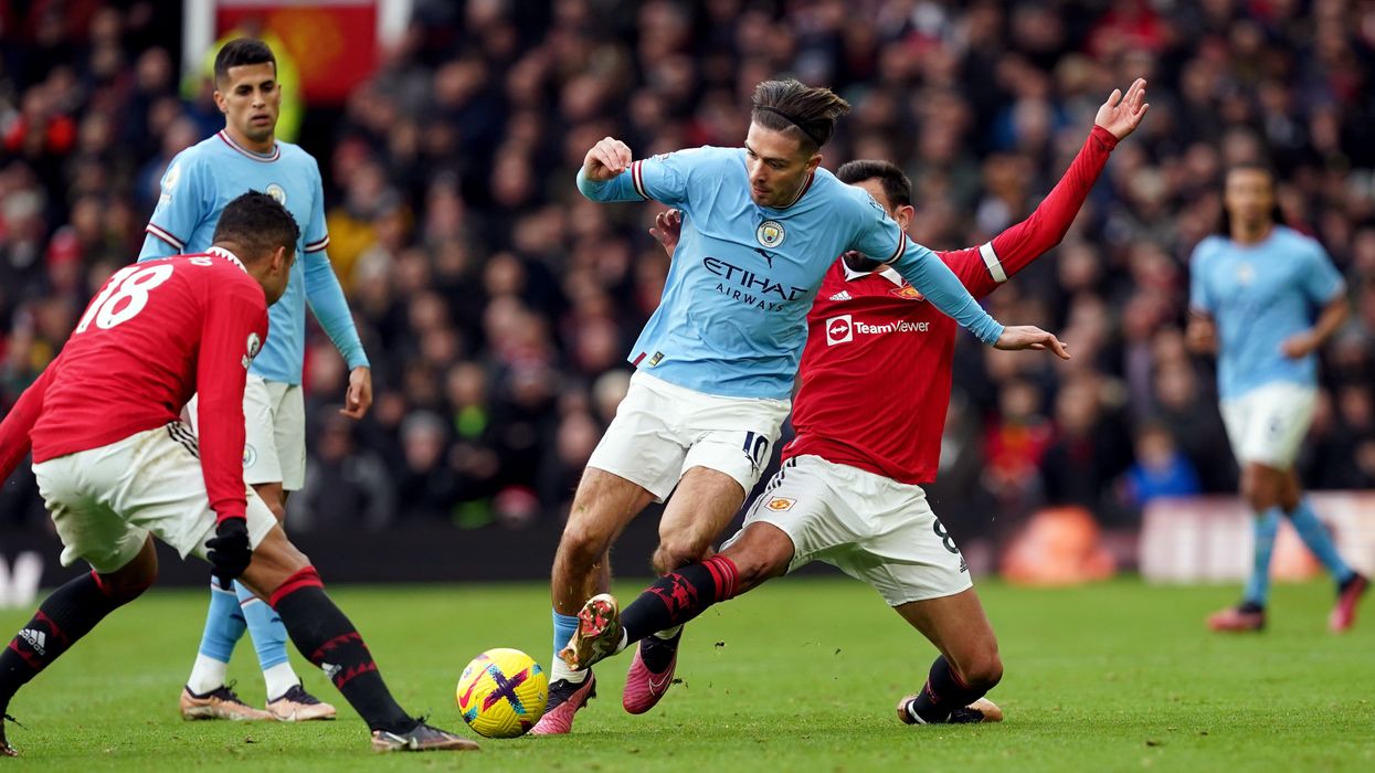 Jack Grealish in action for Manchester City against Manchester United at Old Trafford