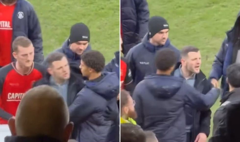 Jack Wilshere had to be held back after confronting Luton fans