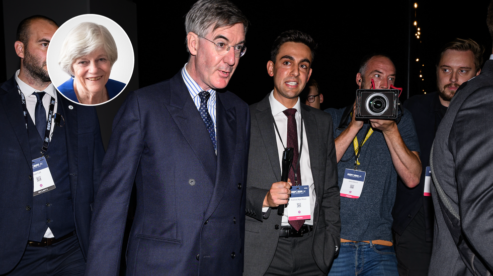 Jacob Rees-Mogg accompanied by the press at Reform UK conference