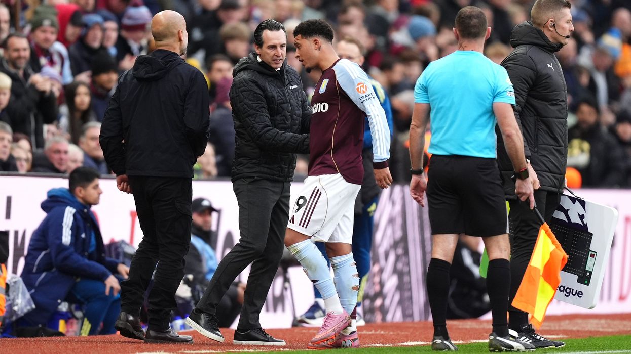 Jadon Sancho brushed past Unai Emery coldly after being subbed on and off