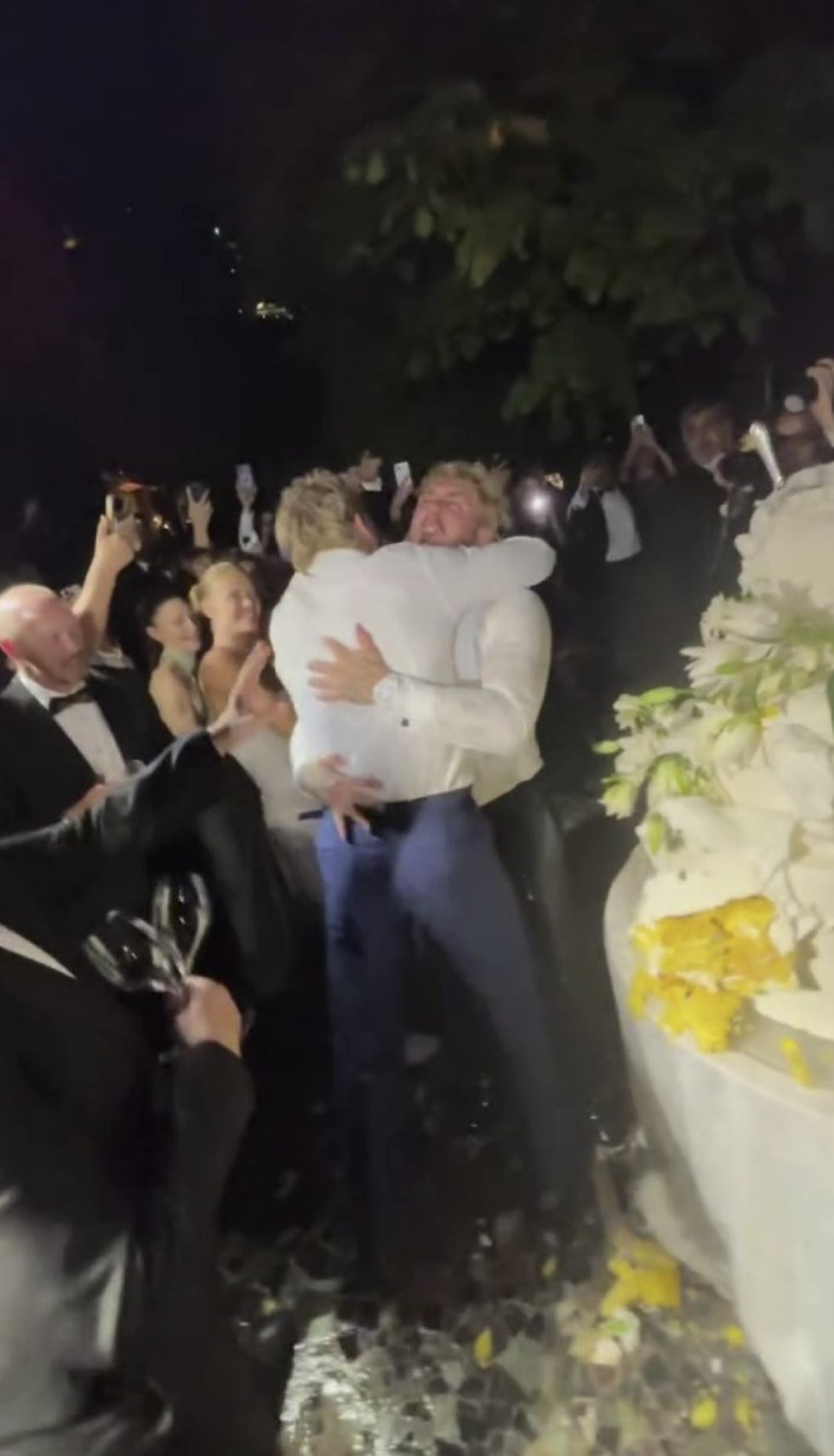 Jake Paul and Logan Paul embraced after the younger brother demolished the expensive dessert
