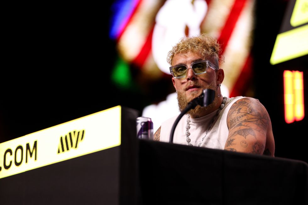 jake paul speaking at a press conference in california