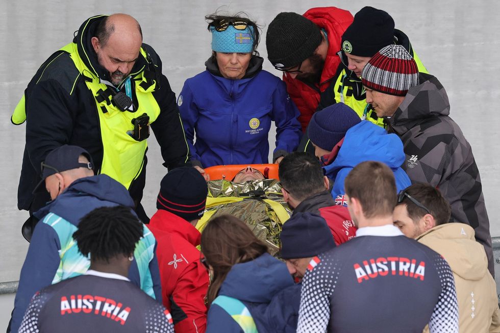 Jakob Mandlbauer's sled overturned on the U-shaped Curve 7 during the second heat of the competition