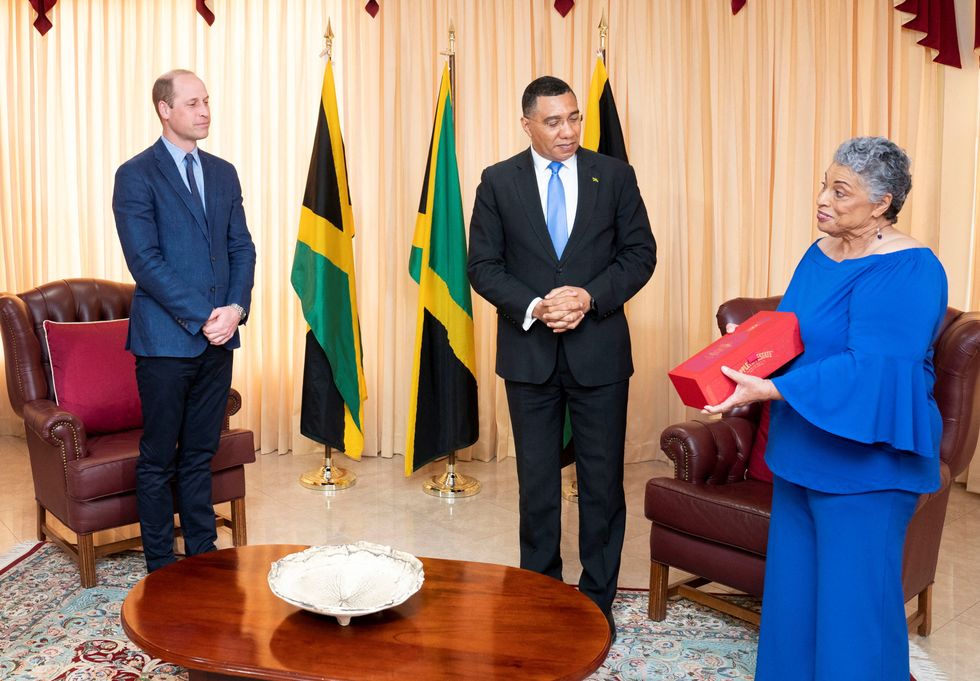 Jamaica's Prime Minister Andrew Holness and master blender Dr. Joy Spence present Britain's Prince William with a bottle of Appleton Estate Ruby during a meeting at his office, on day five of the Platinum Jubilee Royal Tour of the Caribbean, in Kingston, Jamaica.