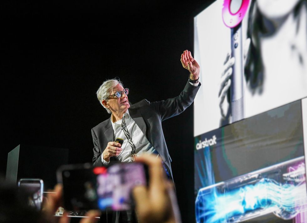 james dyson pictured on stage announcing new dyson supersonic nural