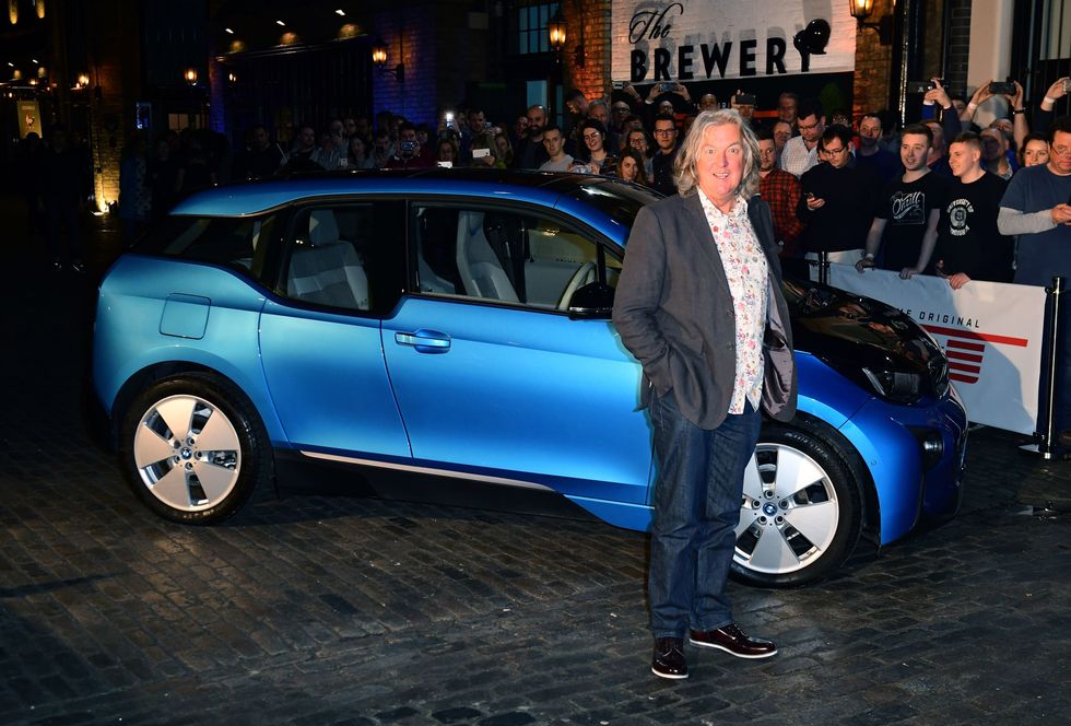 James May next to a blue car