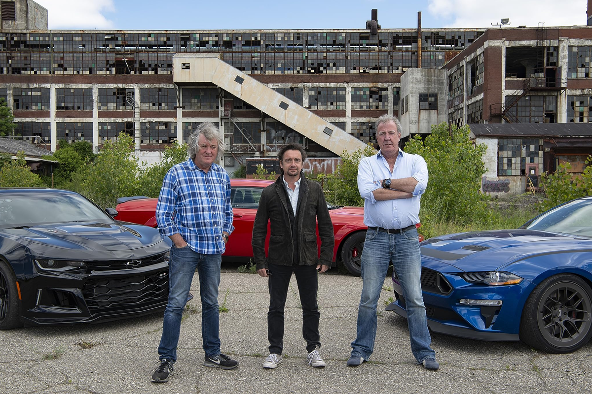 james may richard hammond and jeremy clarkson are pictured standing infront of three supercars