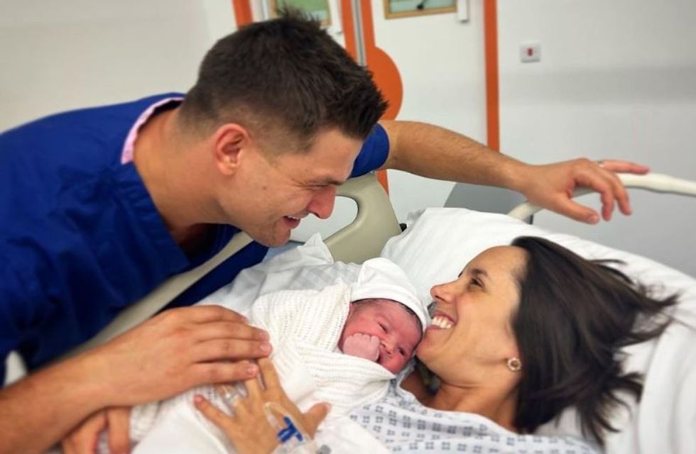 Janette Manrara and Aljaz Skorjanec with their baby