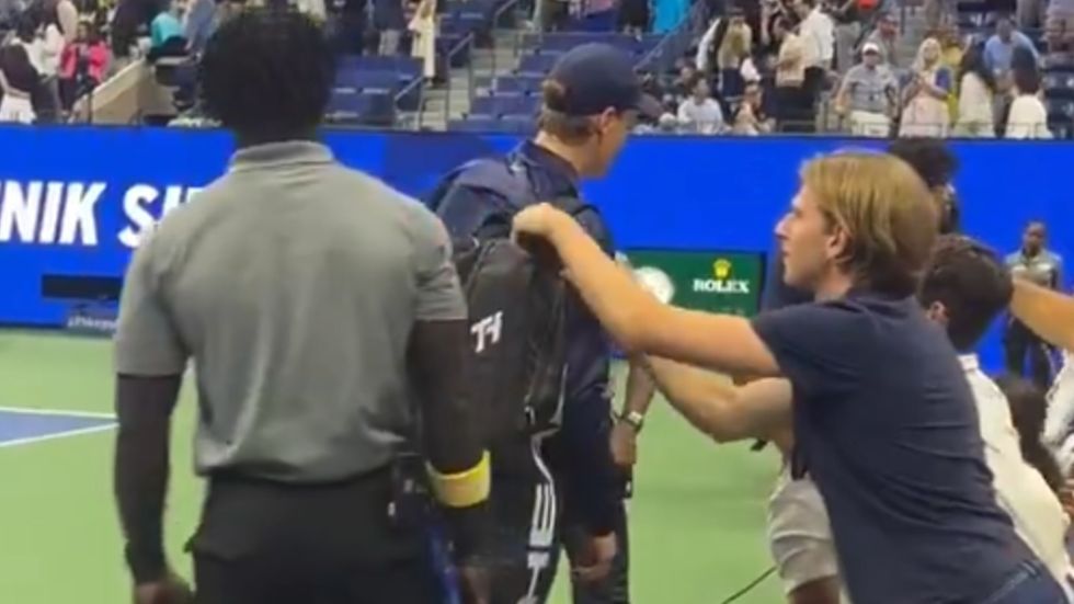 US Open security forced to intervene as fan appears to try and steal something from Jannik Sinner