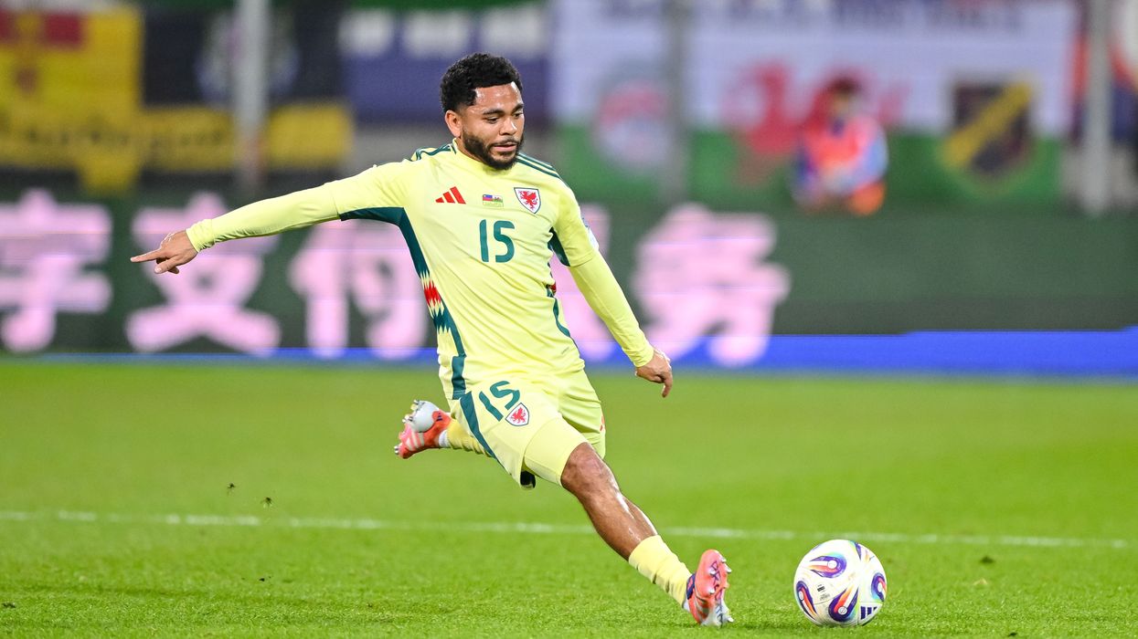 Jay Dasilva of Wales kicking a football in the World Cup qualifier