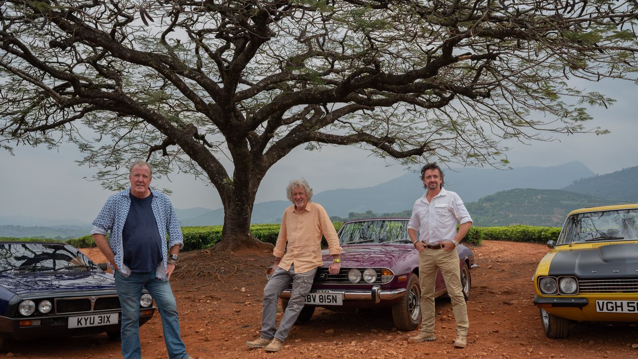 Jeremy Clarkson, James May and Richard Hammond posing in front of vehicles in the final episode of The Grand Tour