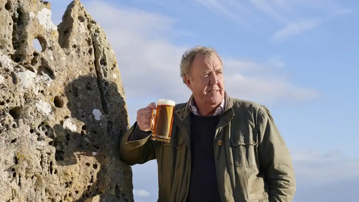 jeremy clarkson pictured with a pint of hawkstone lager outdoors
