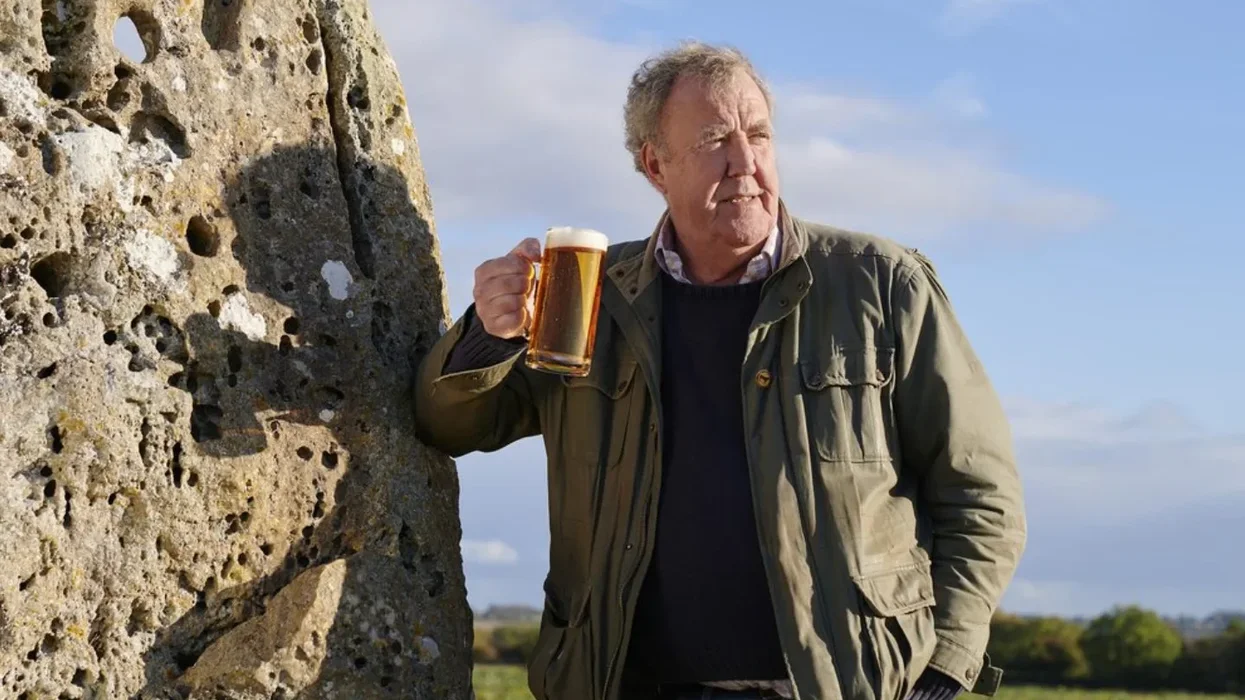 jeremy clarkson pictured with a pint of hawkstone lager outdoors
