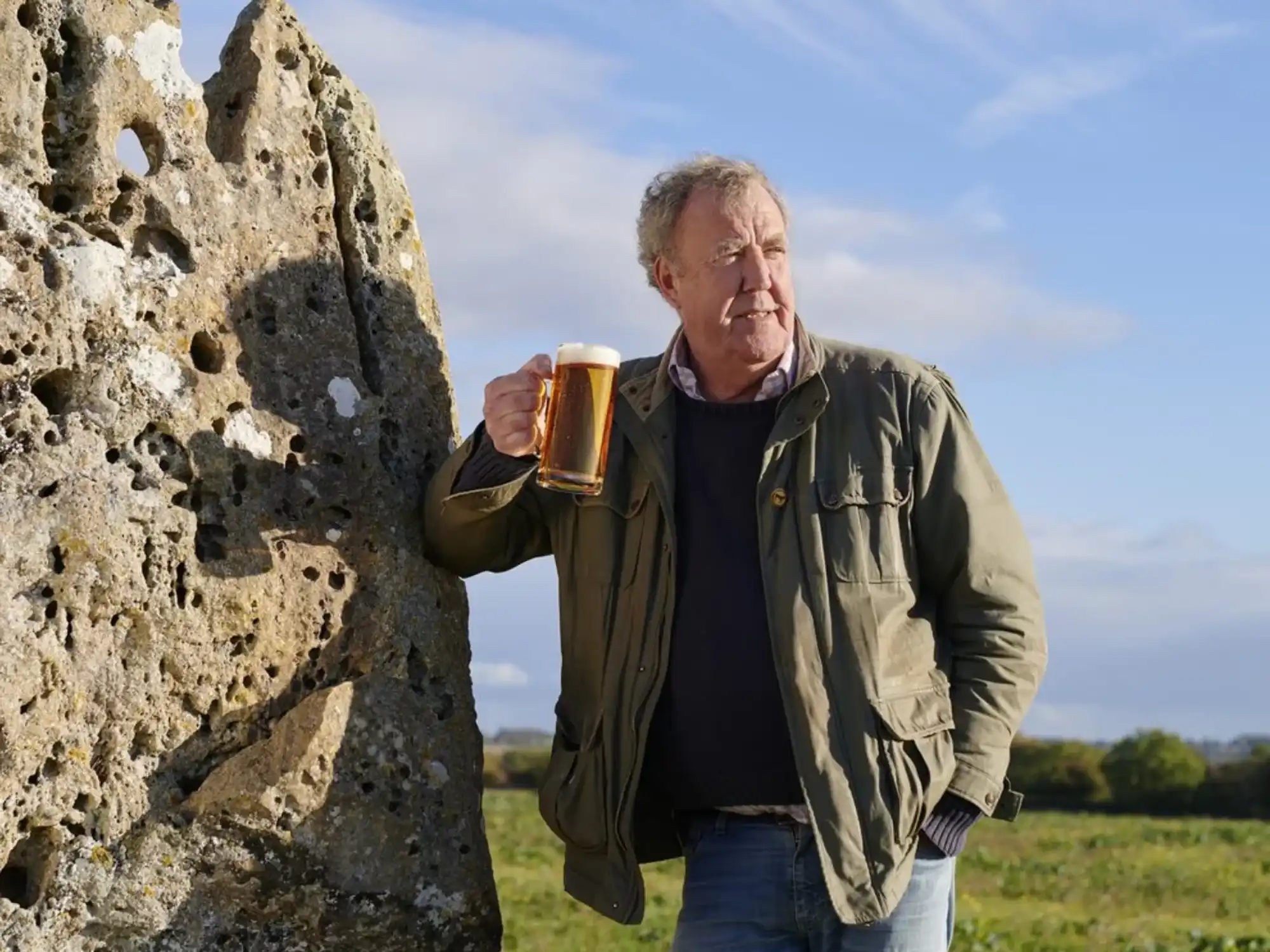 jeremy clarkson pictured with a pint of hawkstone lager outdoors