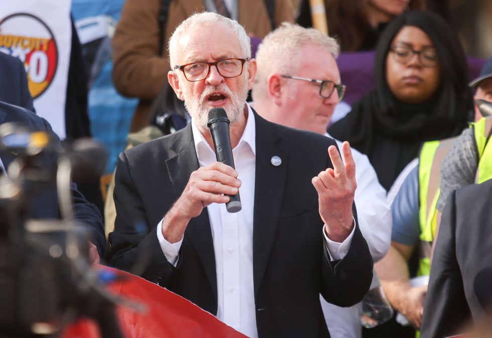 Jeremy Corbyn speaks at a protest by unions outside the Houses of Parliament, London