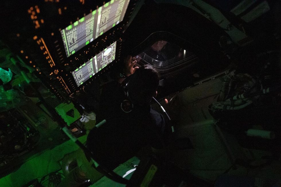 Jeremy Hansen peers out of one of the capsule's windows