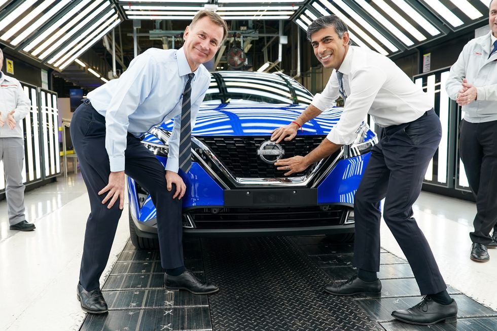 Jeremy Hunt and Rishi Sunak at Nissan's Sunderland factory celebrating a \u00a32billion electric vehicle investment in November 2023