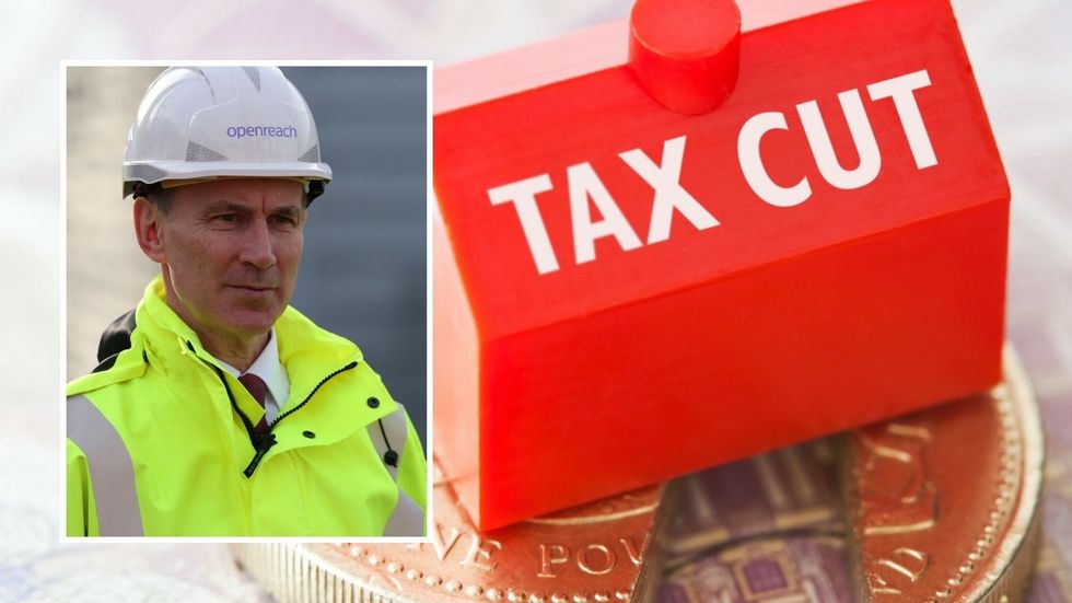 Jeremy Hunt and tax cut sign