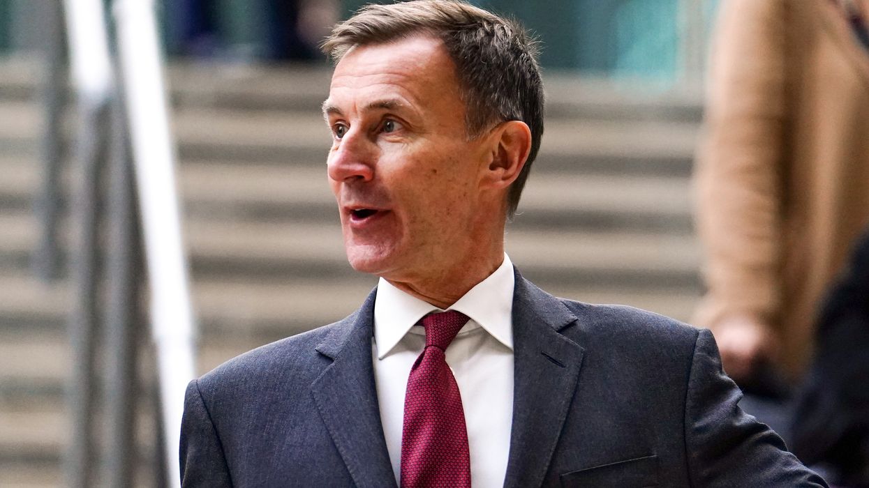 Jeremy Hunt talking on some steps