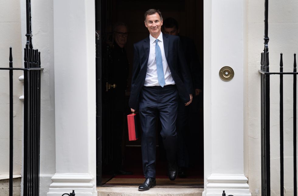 Jeremy Hunt walking out of Downing Street