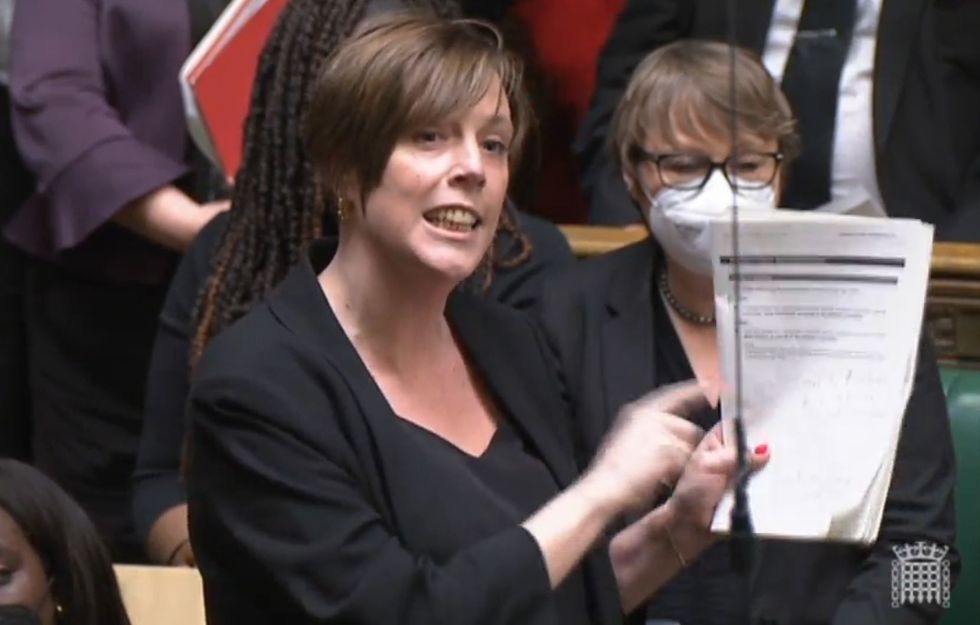 Jess Phillips MP holds the Sue Gray report up as she responds to a statement by Prime Minister Boris Johnson