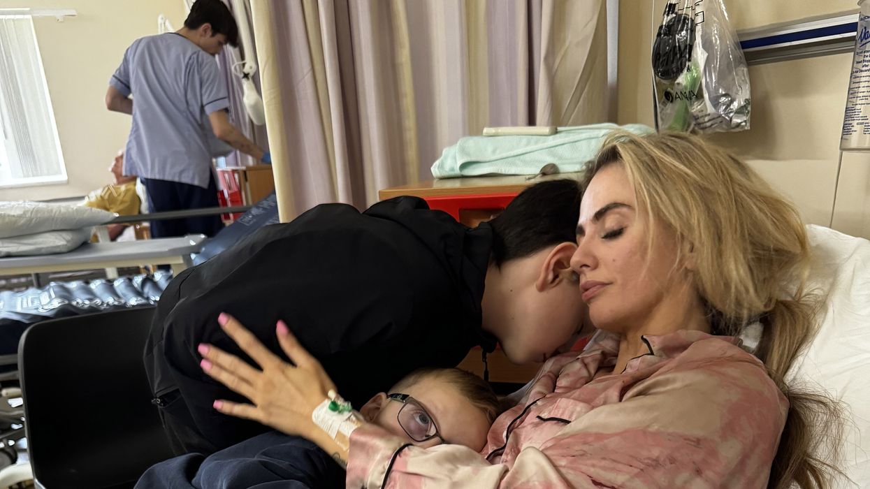 Jess Tierney, 29, comforted by her kids as she recovers from having a stroke in hospital