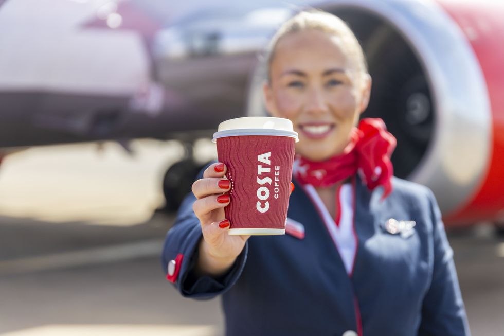 Jet2 air attendant holding Costa Coffee