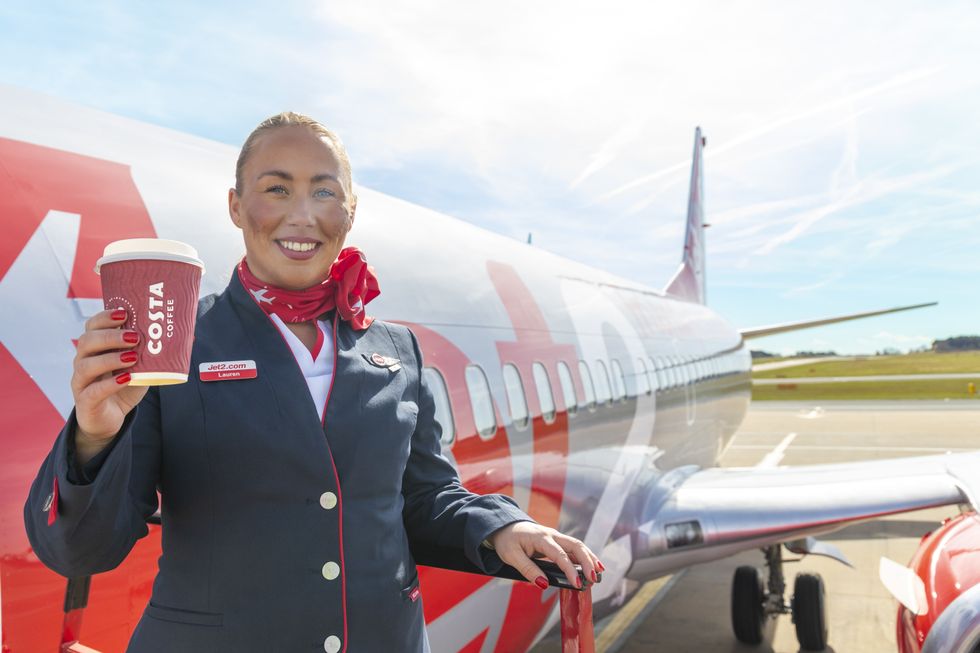 Jet2 air attendant holding Costa Coffee