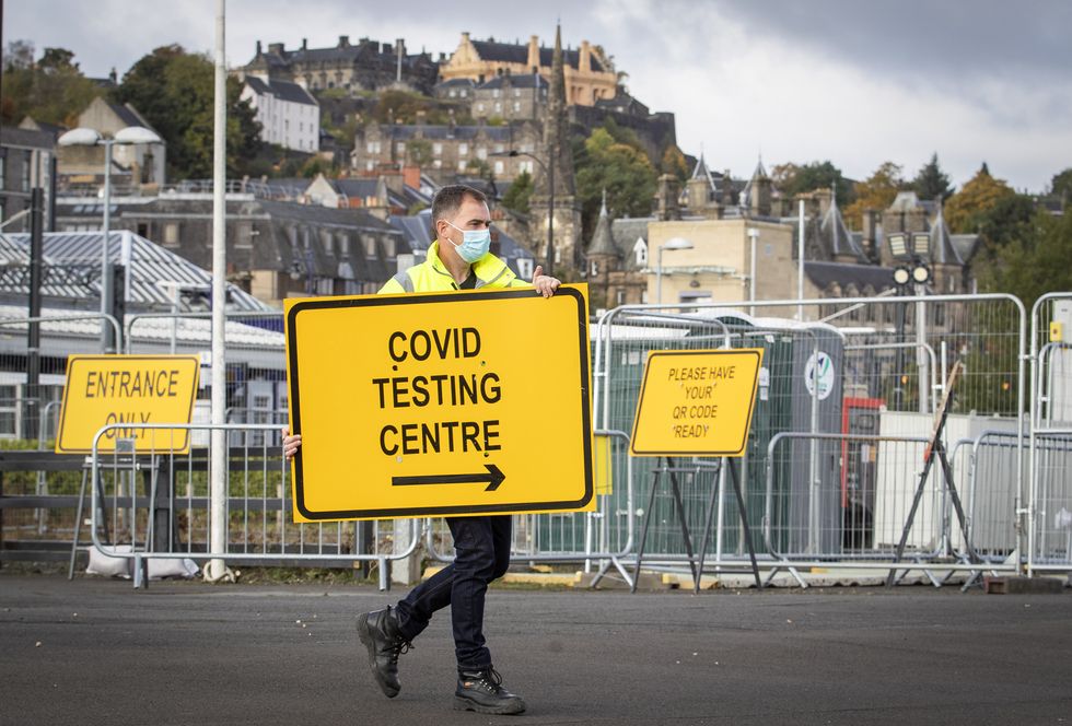 Jim Connell sets up signs at a new walk-through Covid test centre at The Engine Shed, Stirling, which opens to the public today.