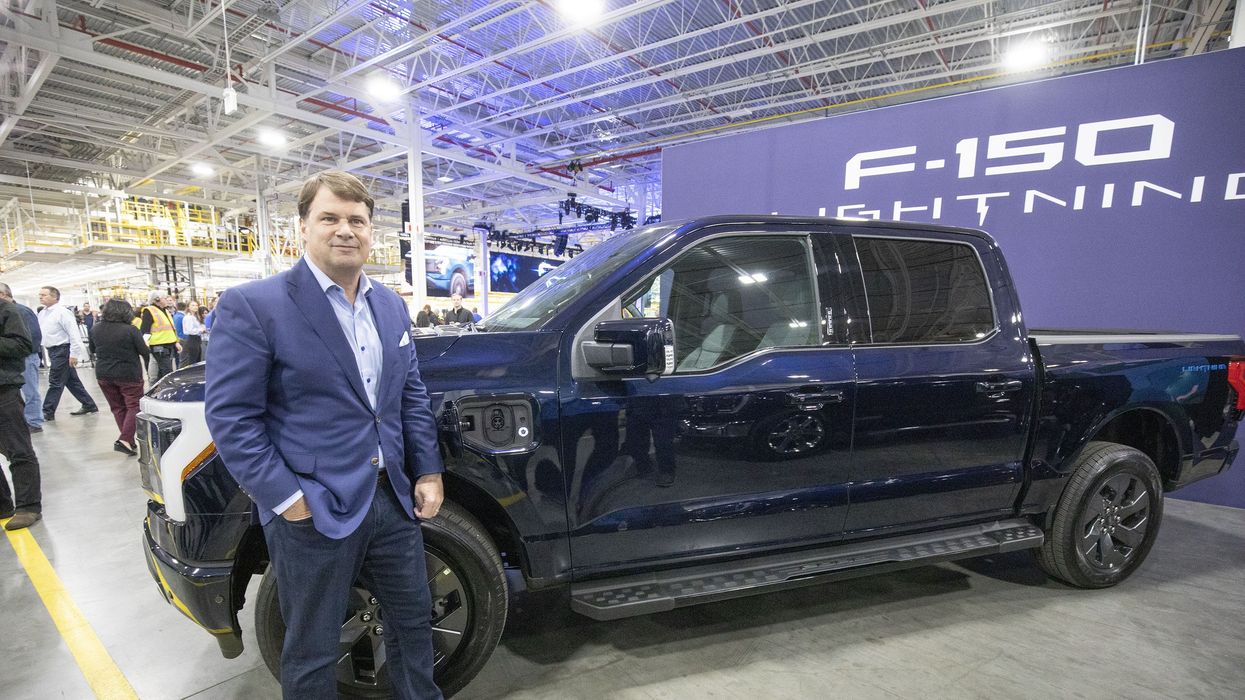 Jim Farley and a Ford EV