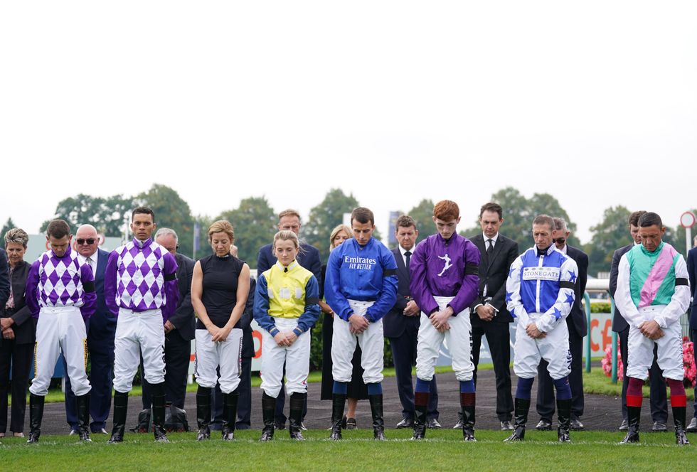 Jockeys hold a 2 minutes silence following the death of Queen Elizabeth II on Thursday of at Doncaster Racecourse. Picture date: Sunday September 11, 2022.